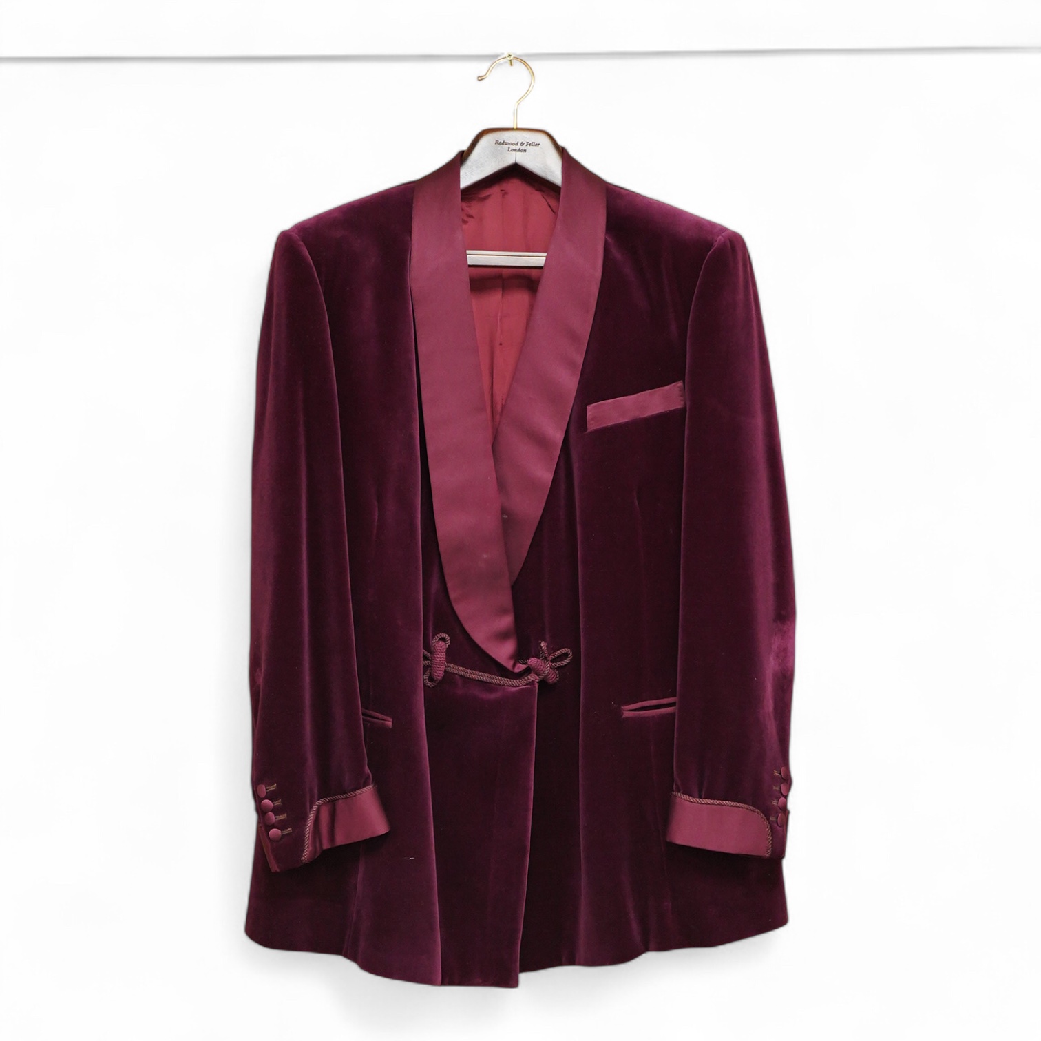 The property of a titled gentleman: A Redwood & Feller maroon velvet mid 20th century gentleman’s smoking jacket, with maroon silk cuff and collar detail, front chest 56cm.